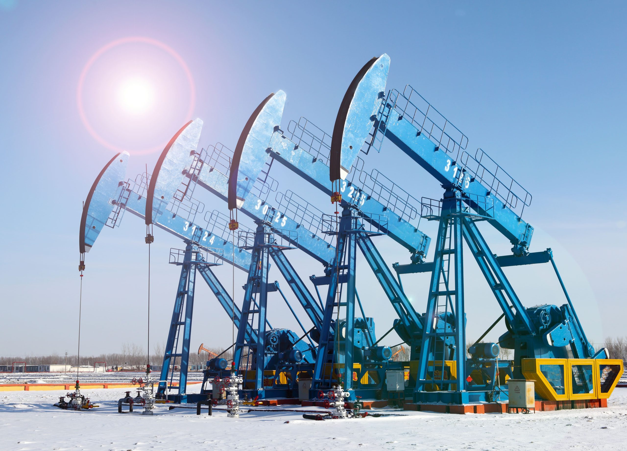 upstream oil and gas facility close up of pumps